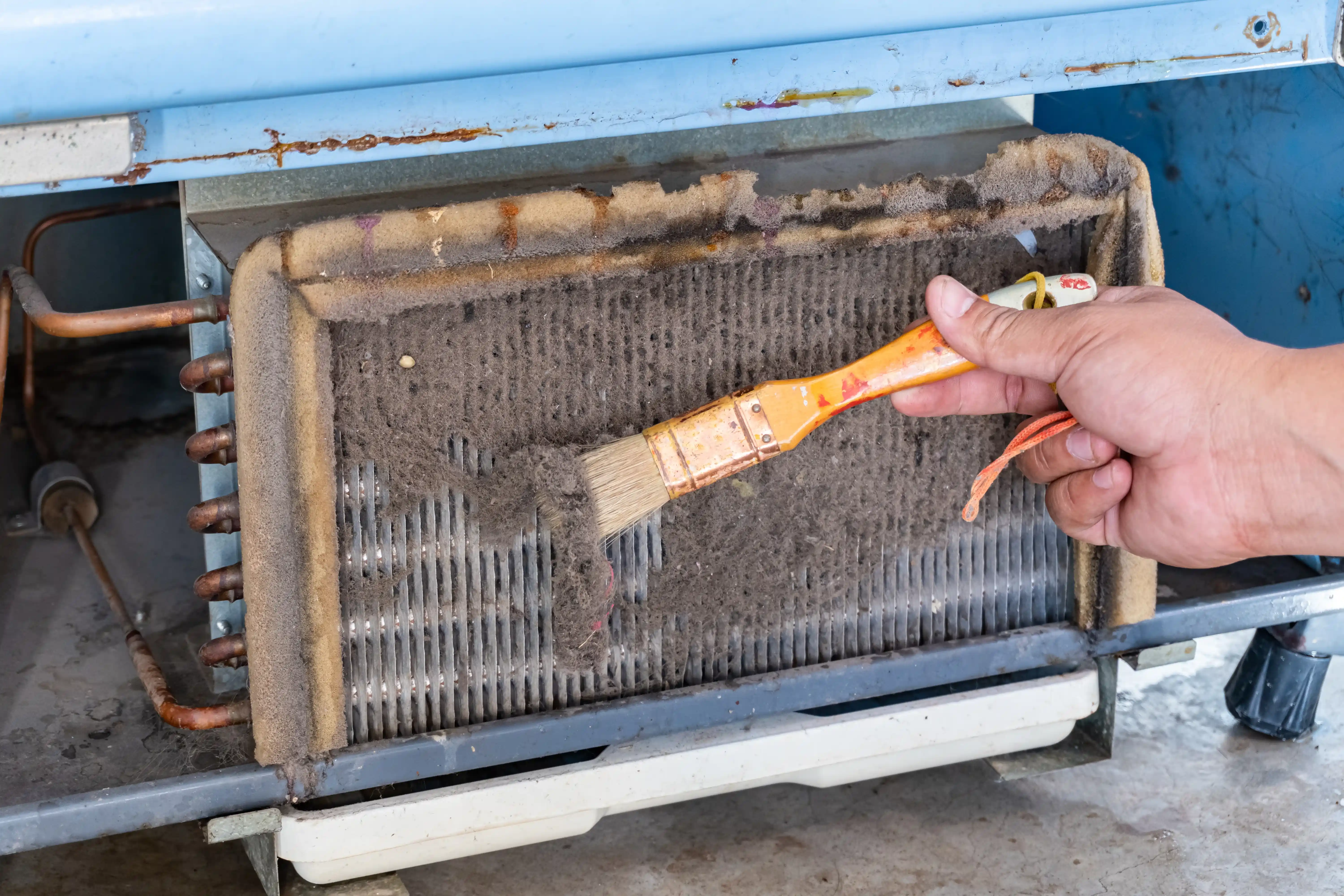 Evaporator coil cleaning in progress.