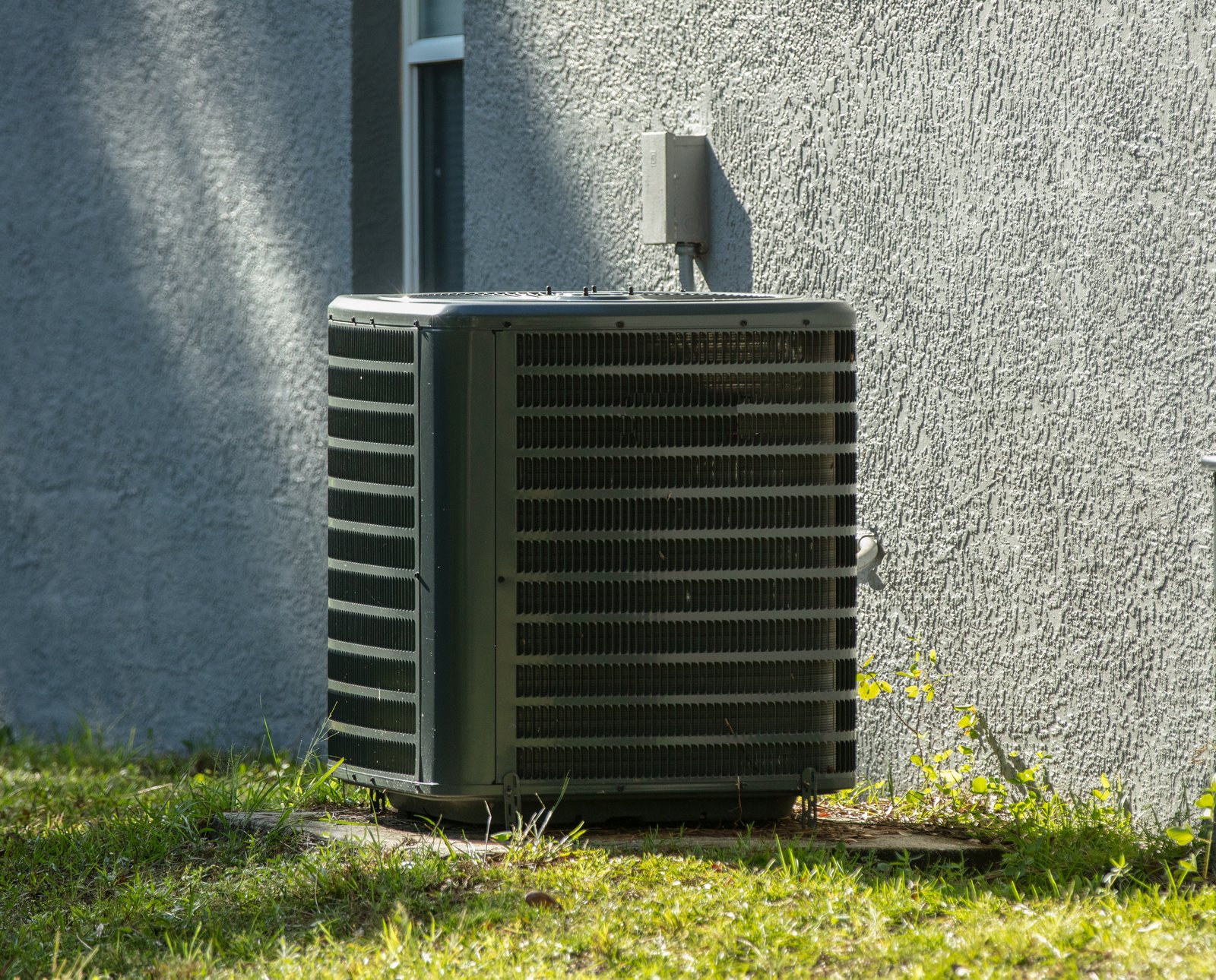 Outdoor HVAC unit next to a house