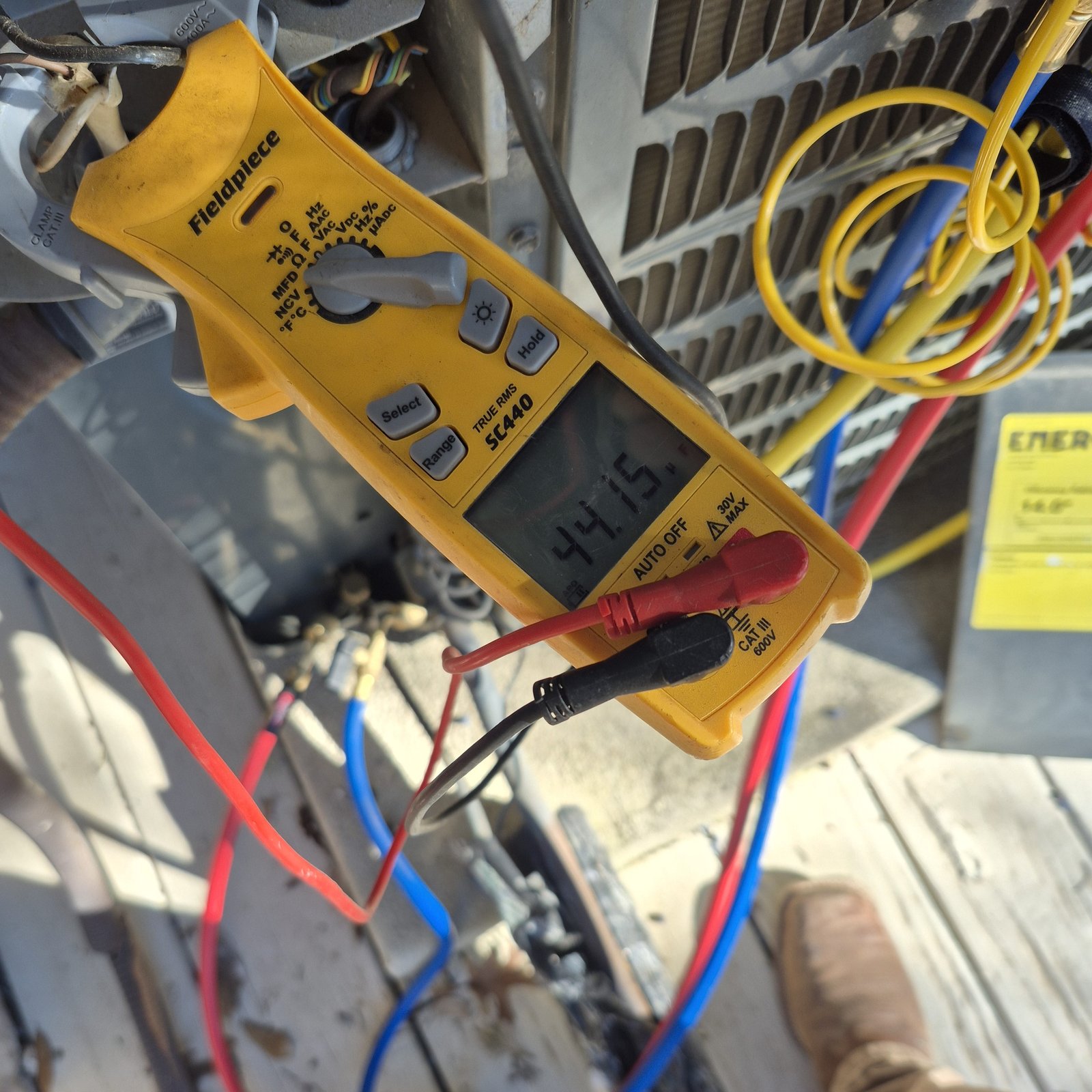 Honey Bee Heating and Air, LLC technician diagnosing an issue during an AC repair service.
